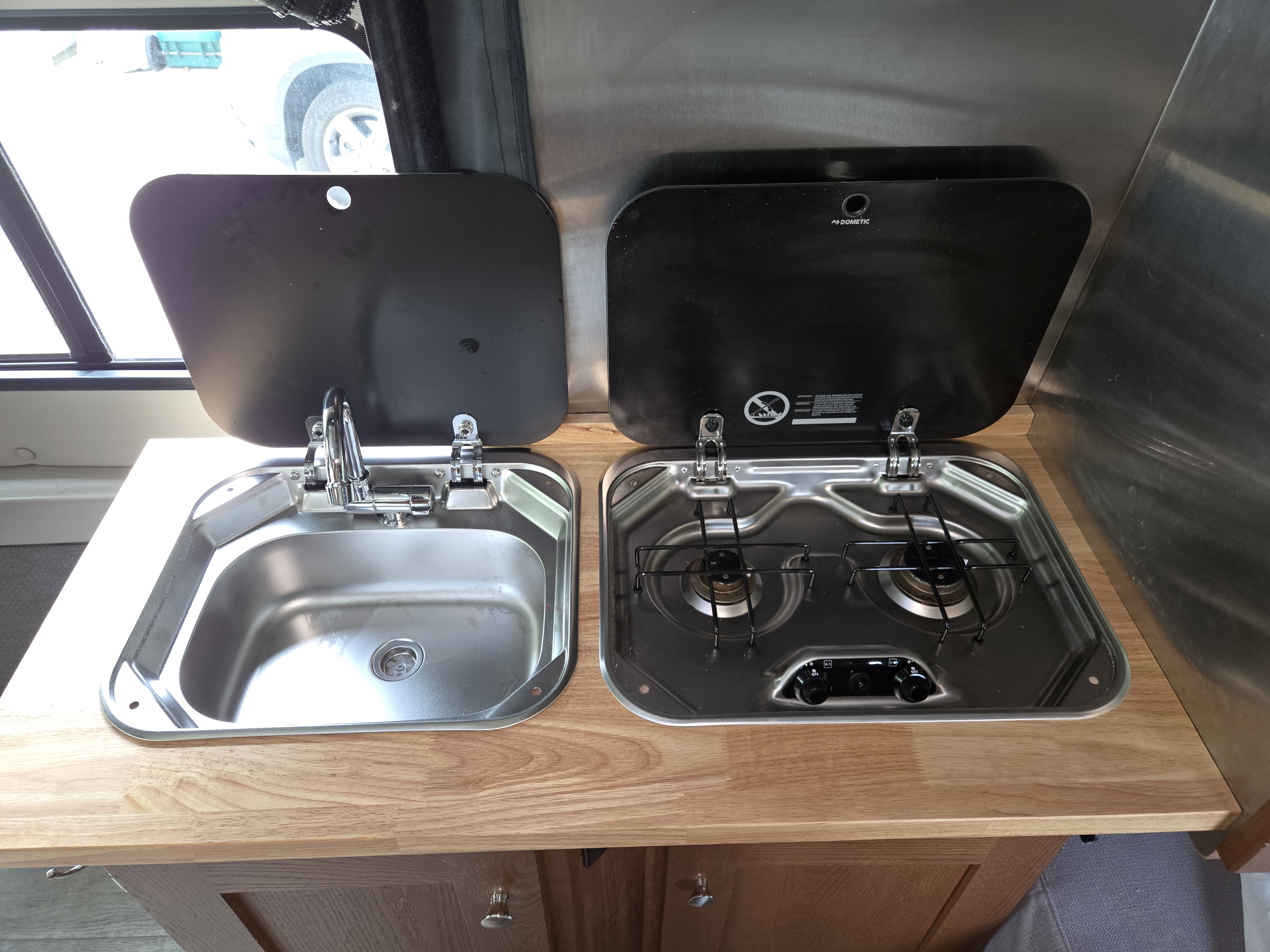 Sink and stove with covers open